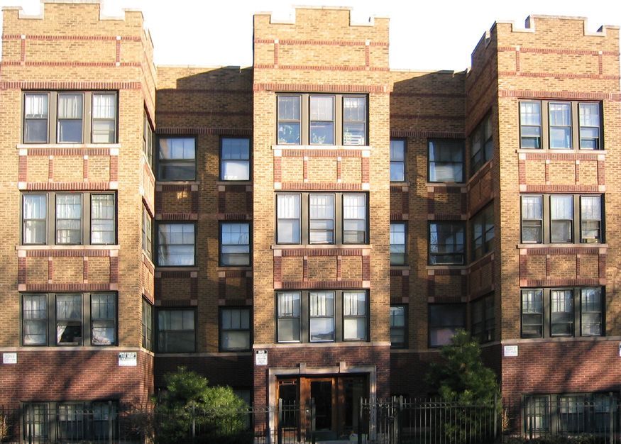 A large brick building with a lot of windows