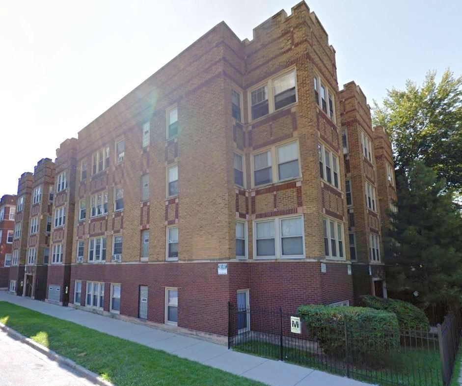 A large brick building with a lot of windows