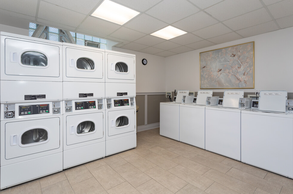 A laundromat with a lot of washers and dryers