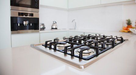 A gas hob in a spotlessly clean kitchen