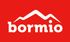 Uno sfondo rosso con una montagna bianca e la scritta bormio