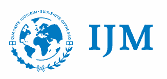 Logo of International Justice Mission: globe emblem and