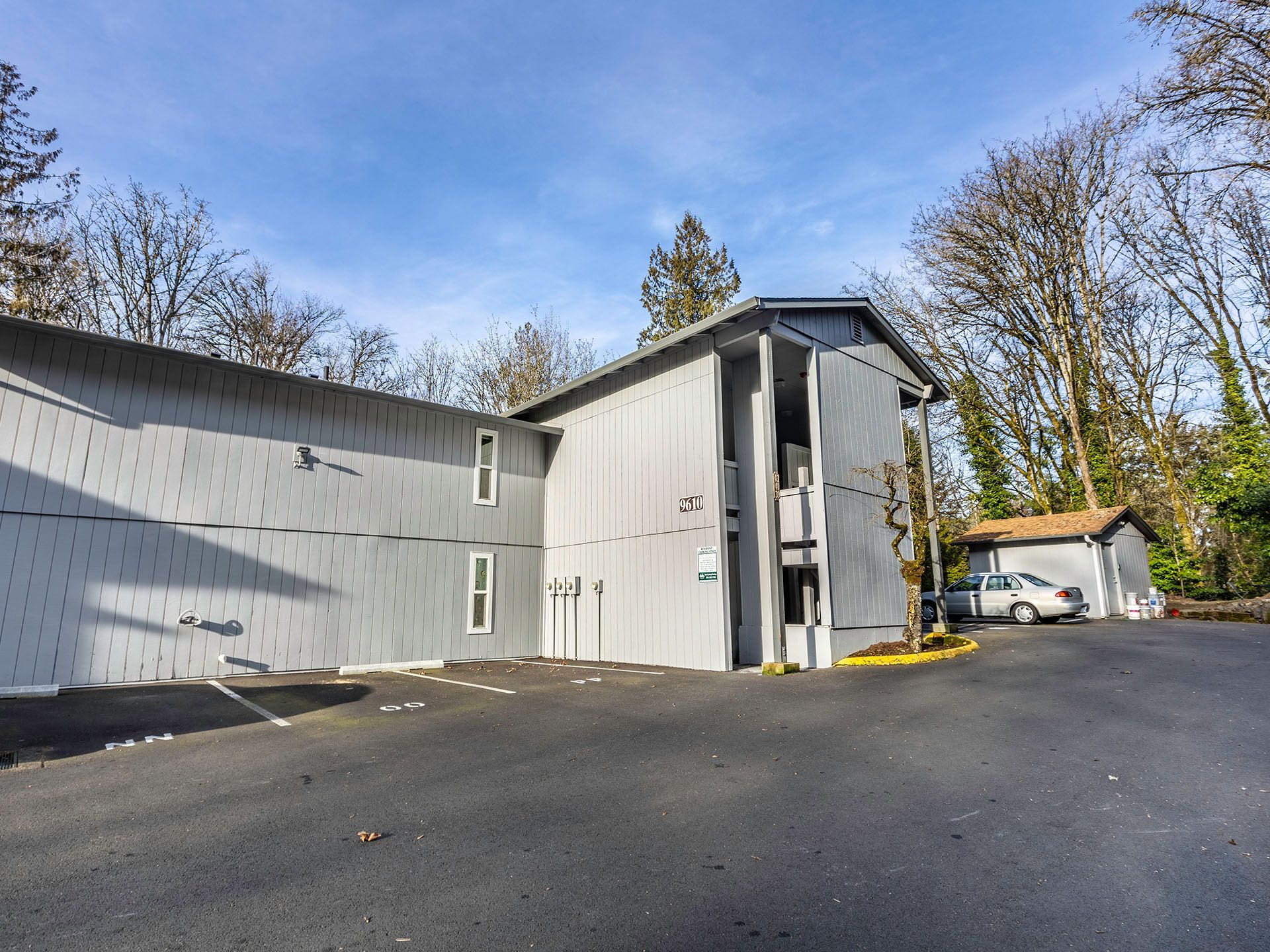 Photo of an apartment building seen from the parking lot
