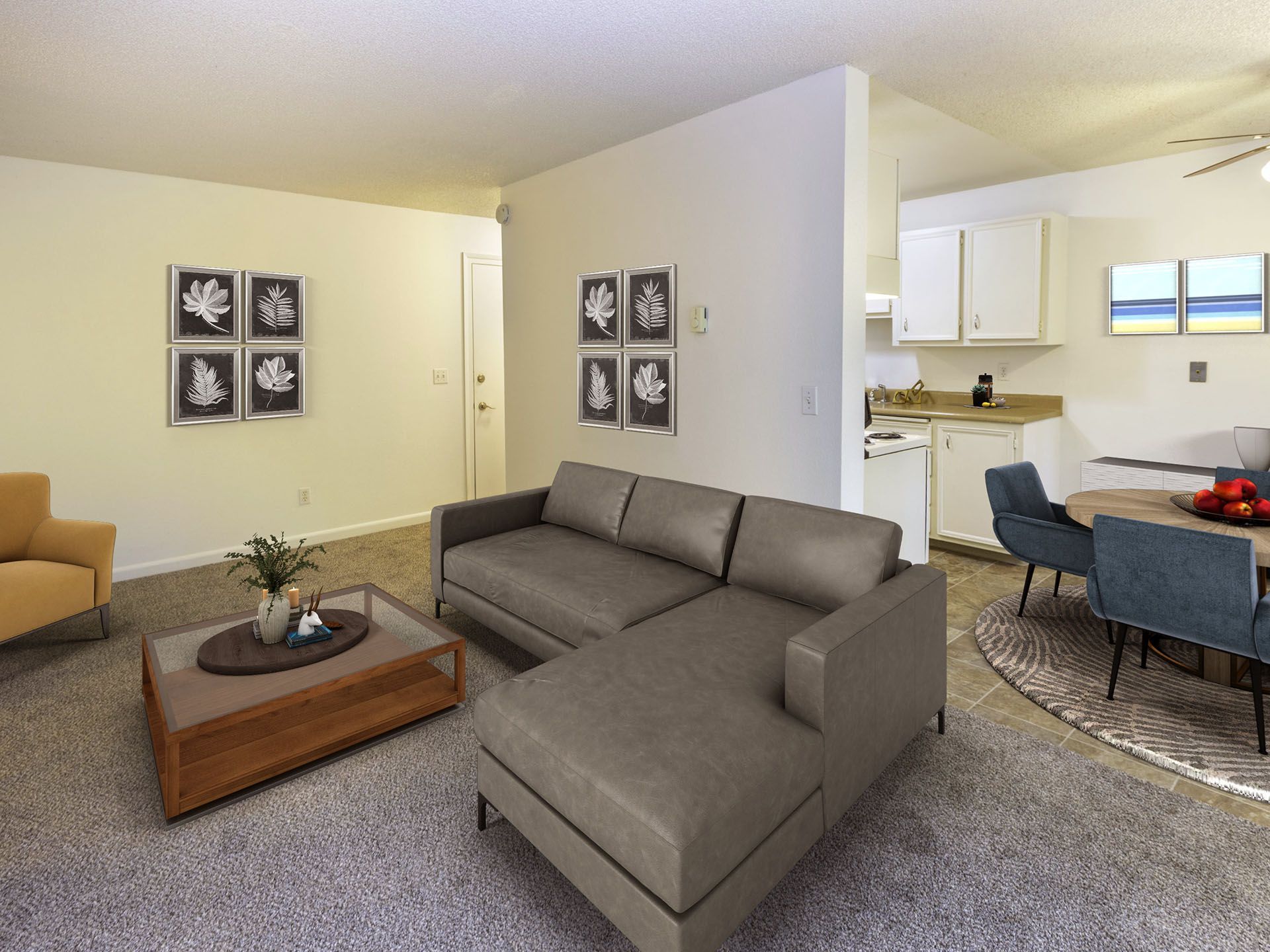 Photo of a living room with the dining area in the middleground and the kitchen in the background
