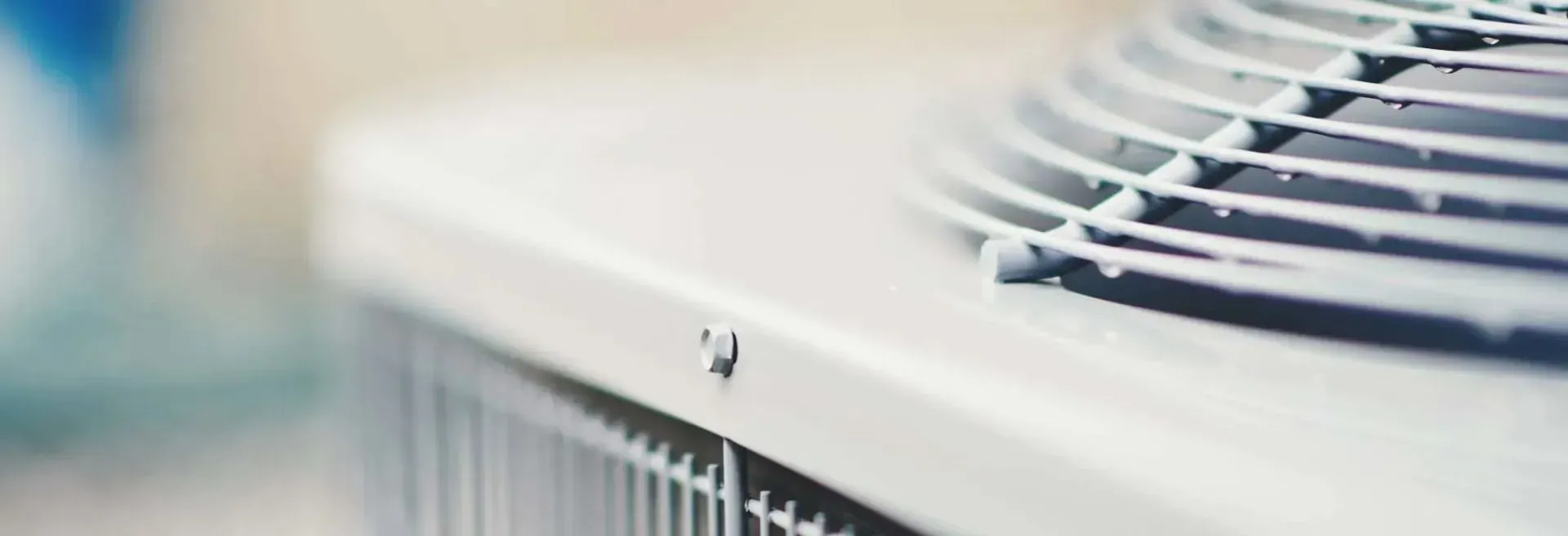 A close up of an air conditioner with a fan on top of it.