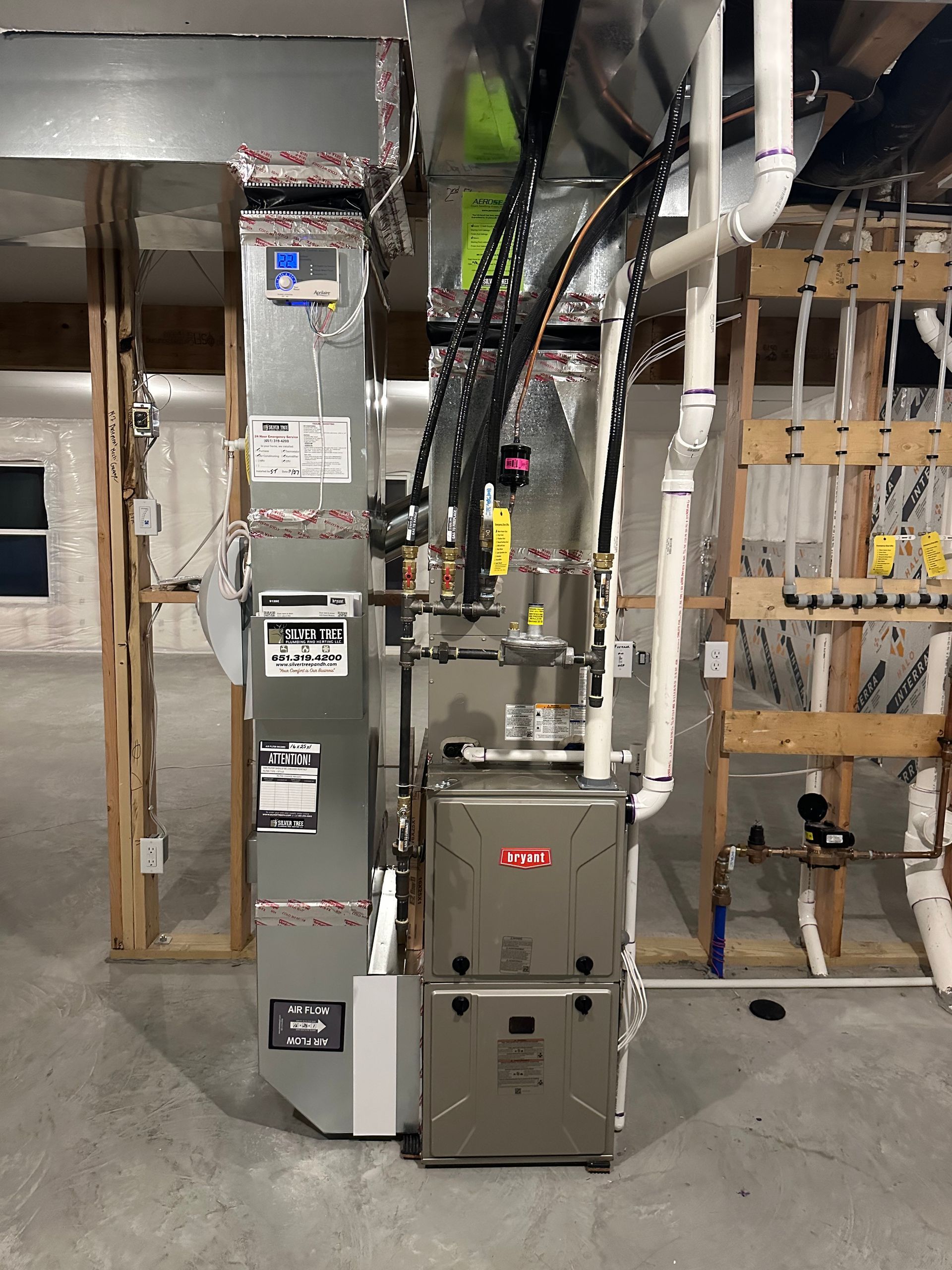 A heating and cooling system is installed in a basement.