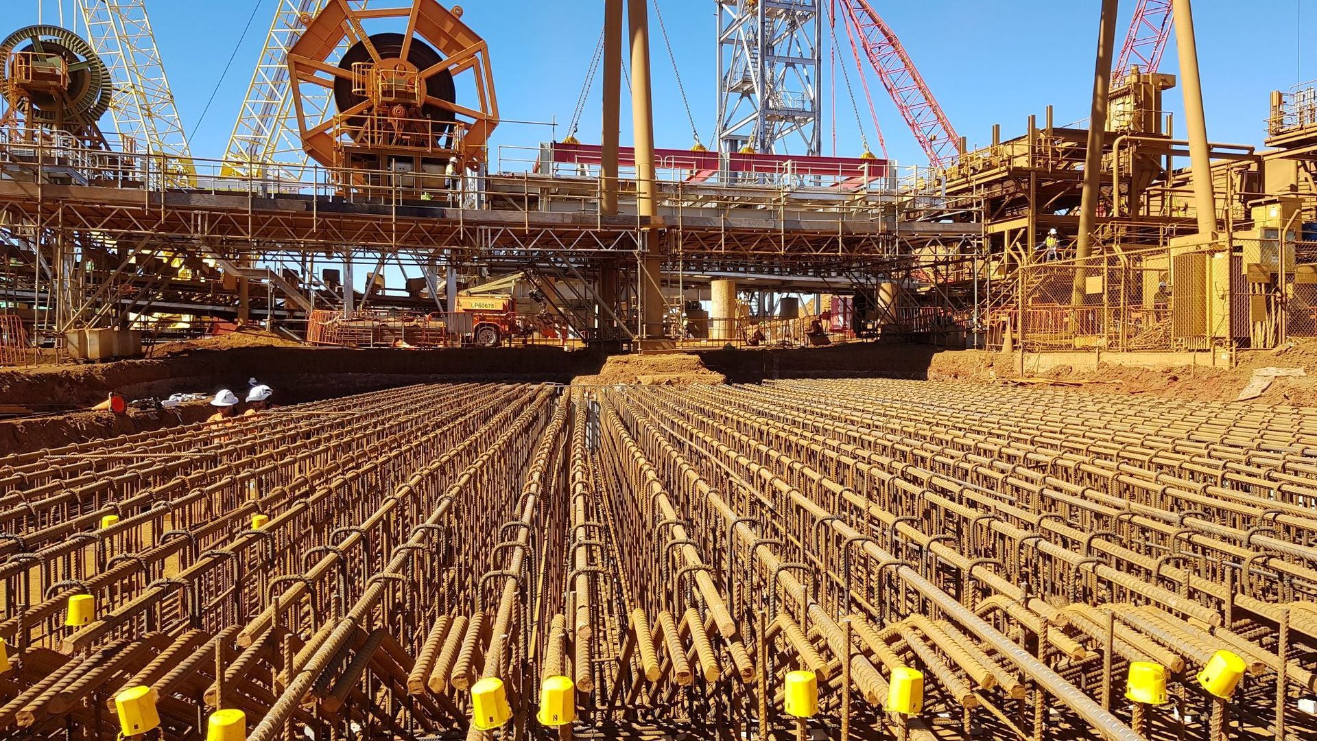 A large construction site with a lot of machinery in the background.