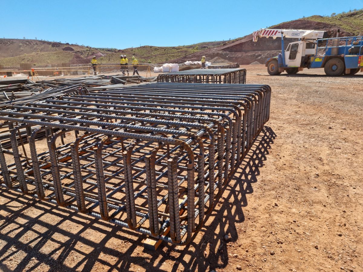 Steel fixing specialists reinforcing a large metal framework.Western Steel Fixers.