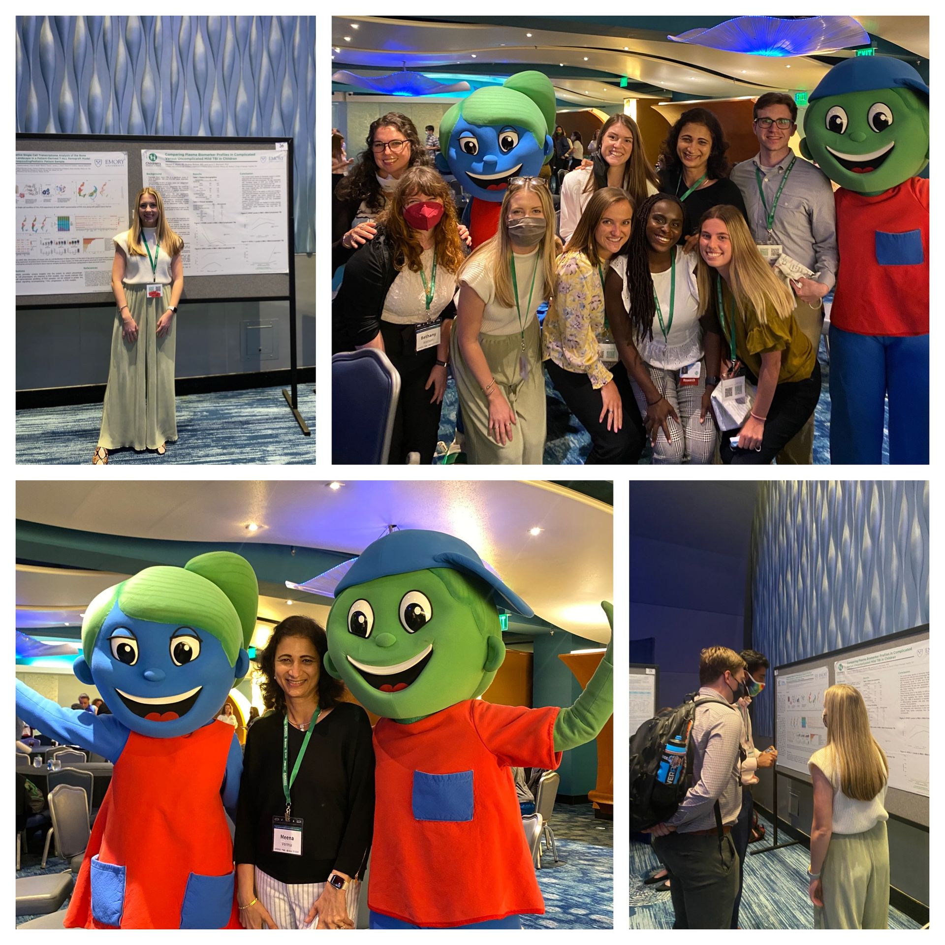 A group of people are posing for a picture with mascots.
