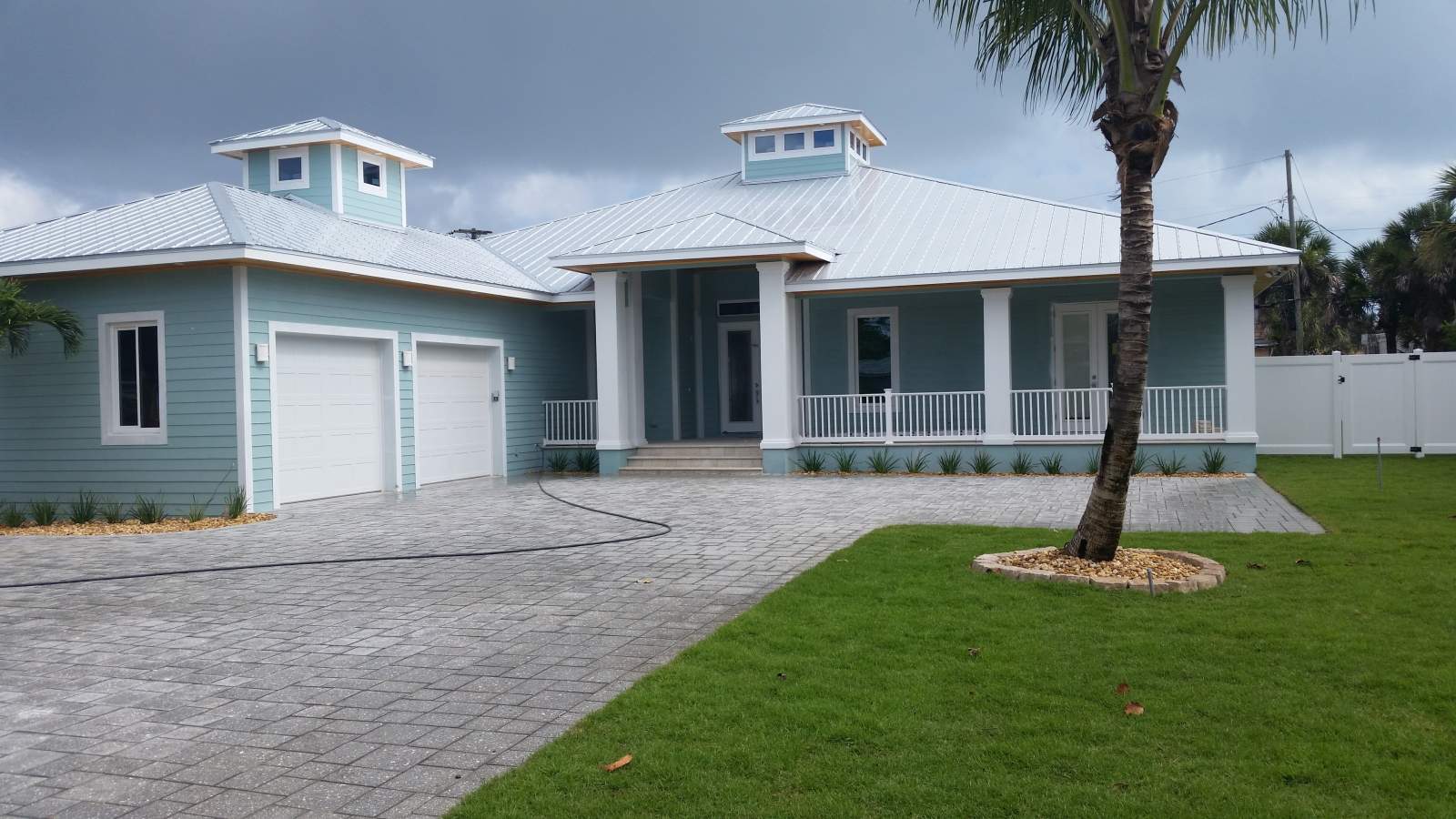 Outdoor View of a Home Painted with Blue — Vero Beach, FL — Bucio Painting Inc.