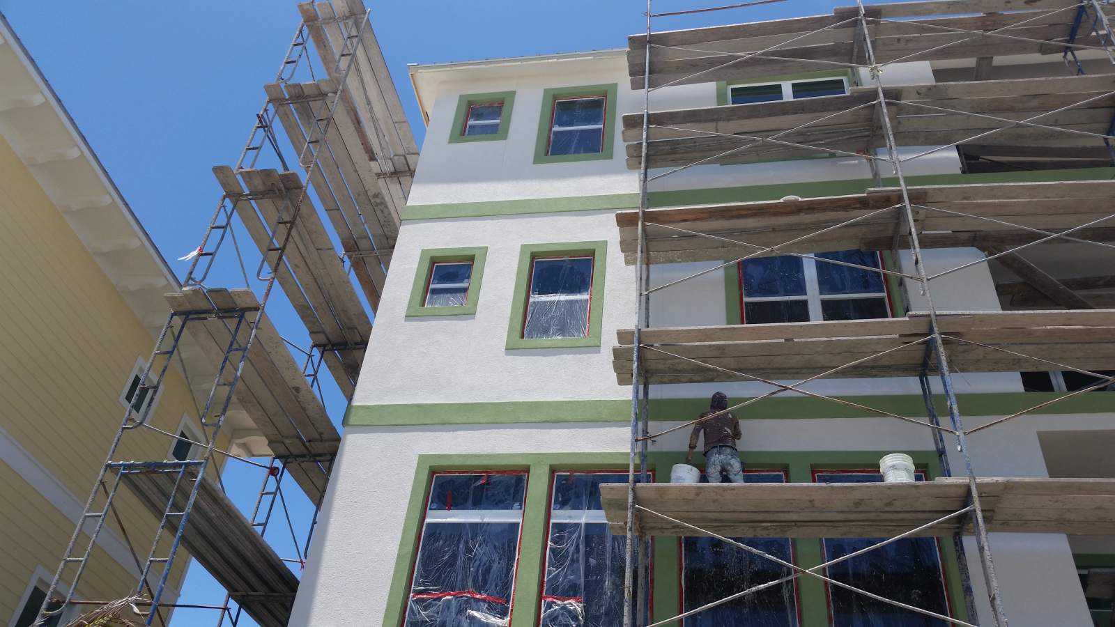 Green and White Building — Vero Beach, FL — Bucio Painting Inc.