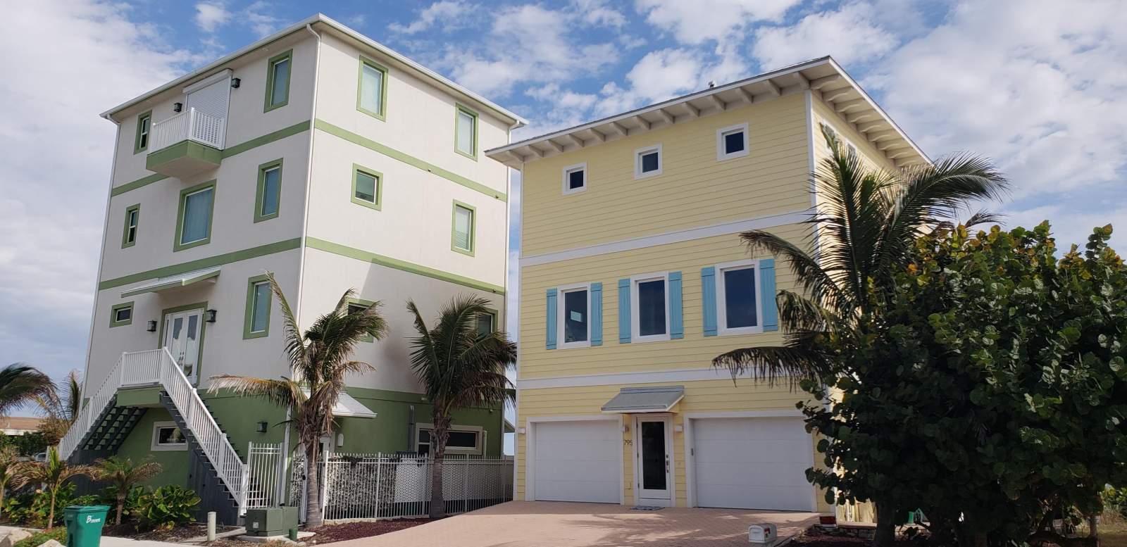 Two Buildings Painted with Green and Yellow — Vero Beach, FL — Bucio Painting Inc.