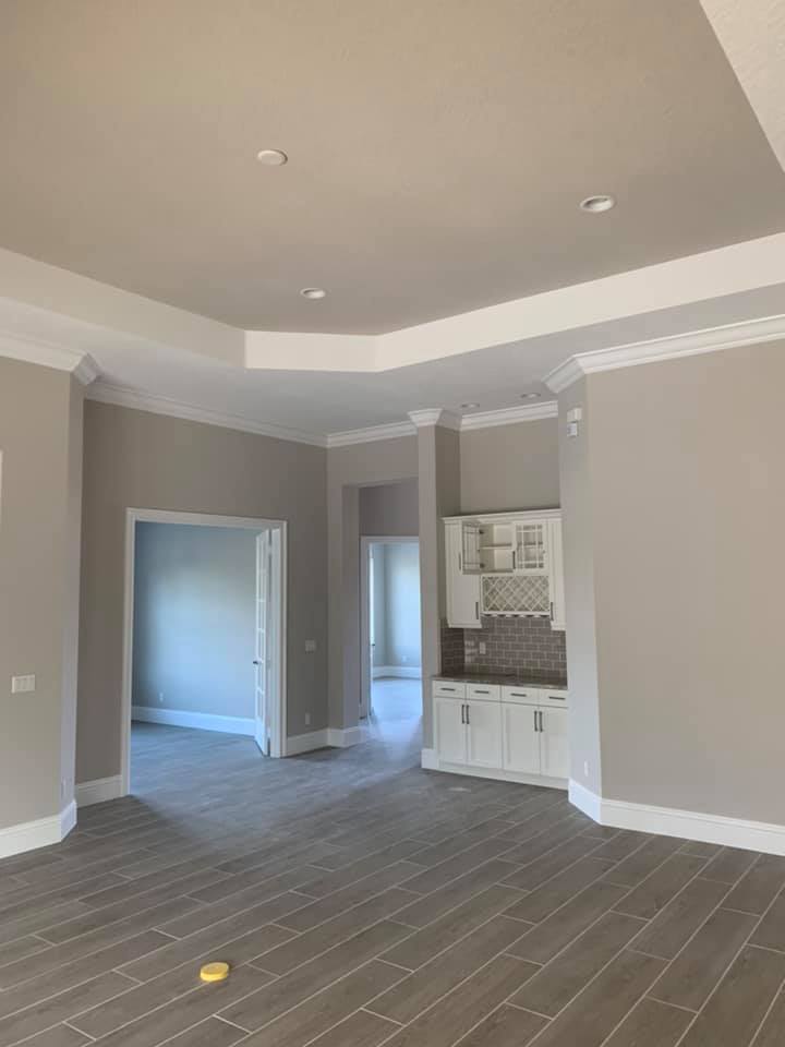 Man Painting Interior House — Vero Beach, FL — Bucio Painting Inc.