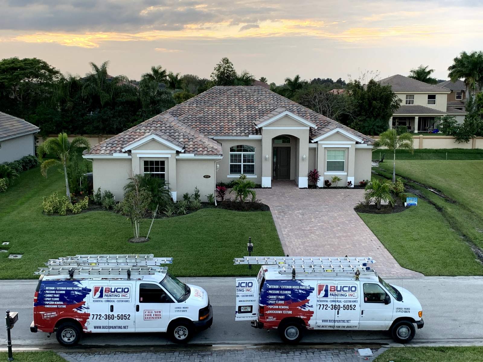 Home With Two Bucio Painting Vans in Front — Vero Beach, FL — Bucio Painting Inc.