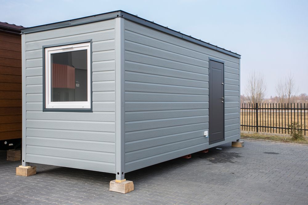 Grey Rectangular Cabin With a Window — The Wright Way Building In North Albury, NSW