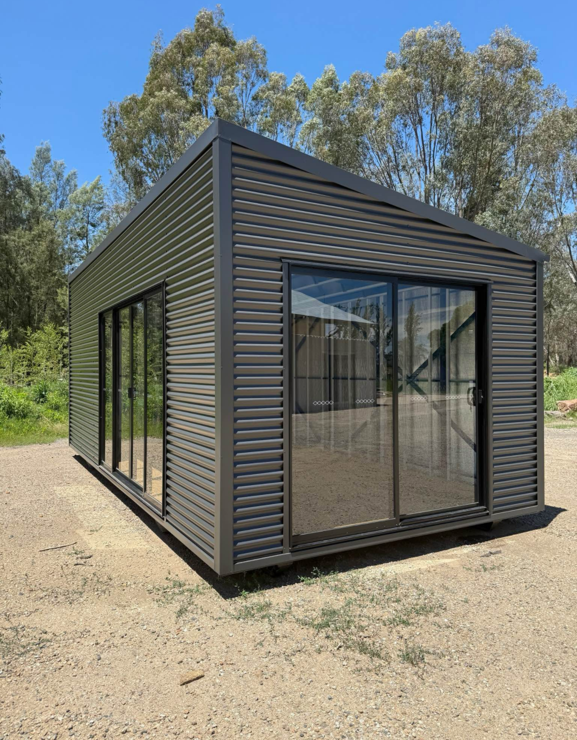 Dark Grey, Modern Cabin With Large Sliding Glass Doors — The Wright Way Building In North Albury, NSW