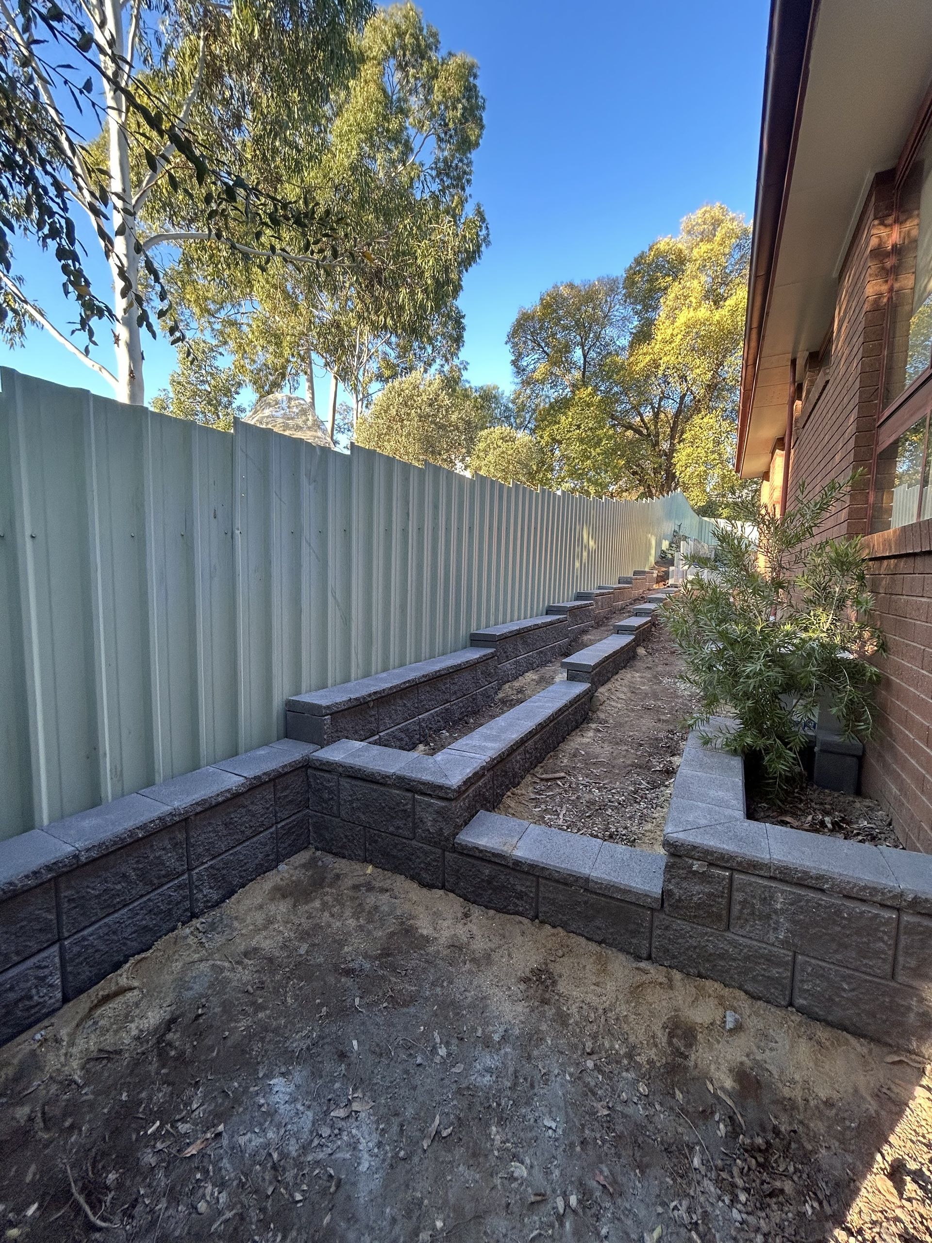 Brick Retaining Wall With Tiered Garden Beds — The Wright Way Building In North Albury, NSW