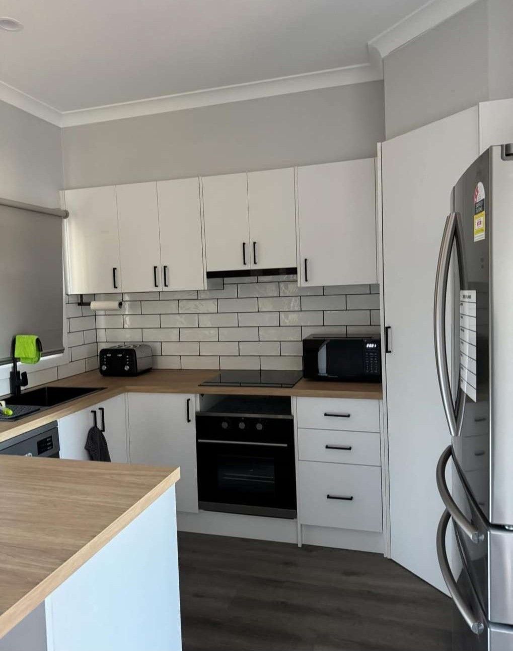 White Kitchen With Wooden Countertops — The Wright Way Building In North Albury, NSW