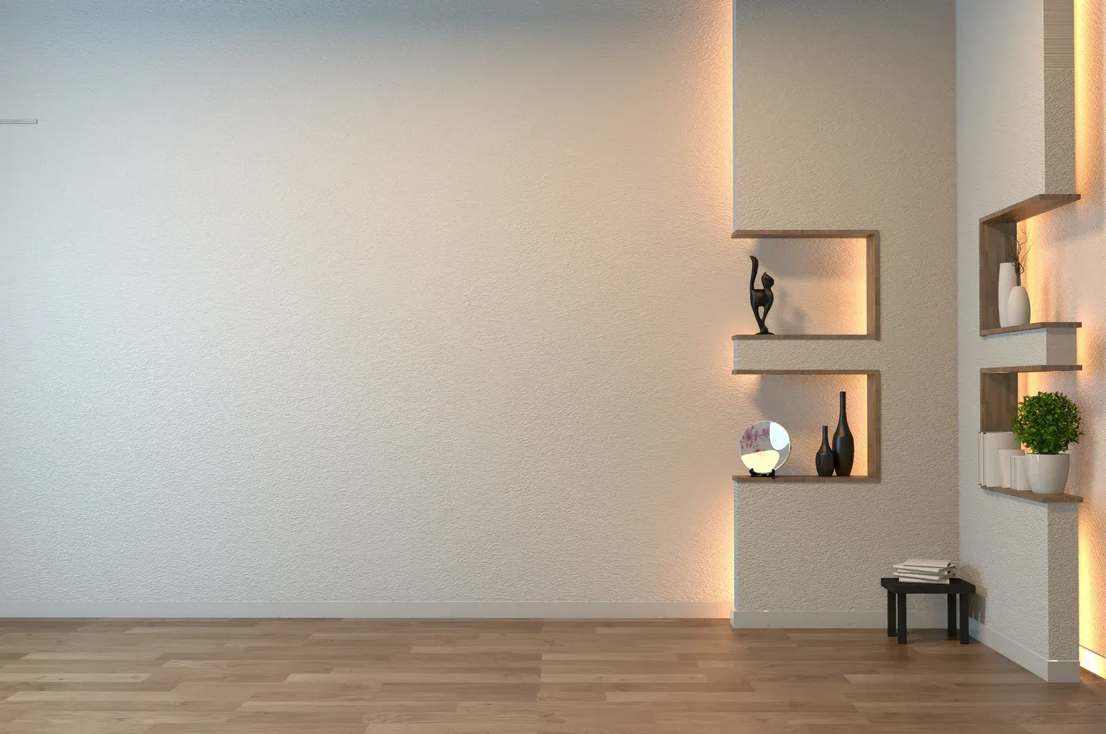 Minimalist empty room with white walls, wood floor, and small wall shelves holding decor and a plant.