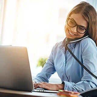 Woman talking with client at the phone — Property Insurance in Merrillville, IN