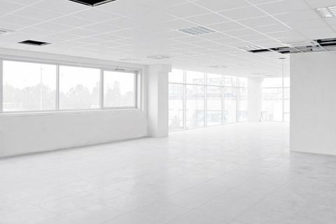 Empty bright interior white office under construction without furniture inside