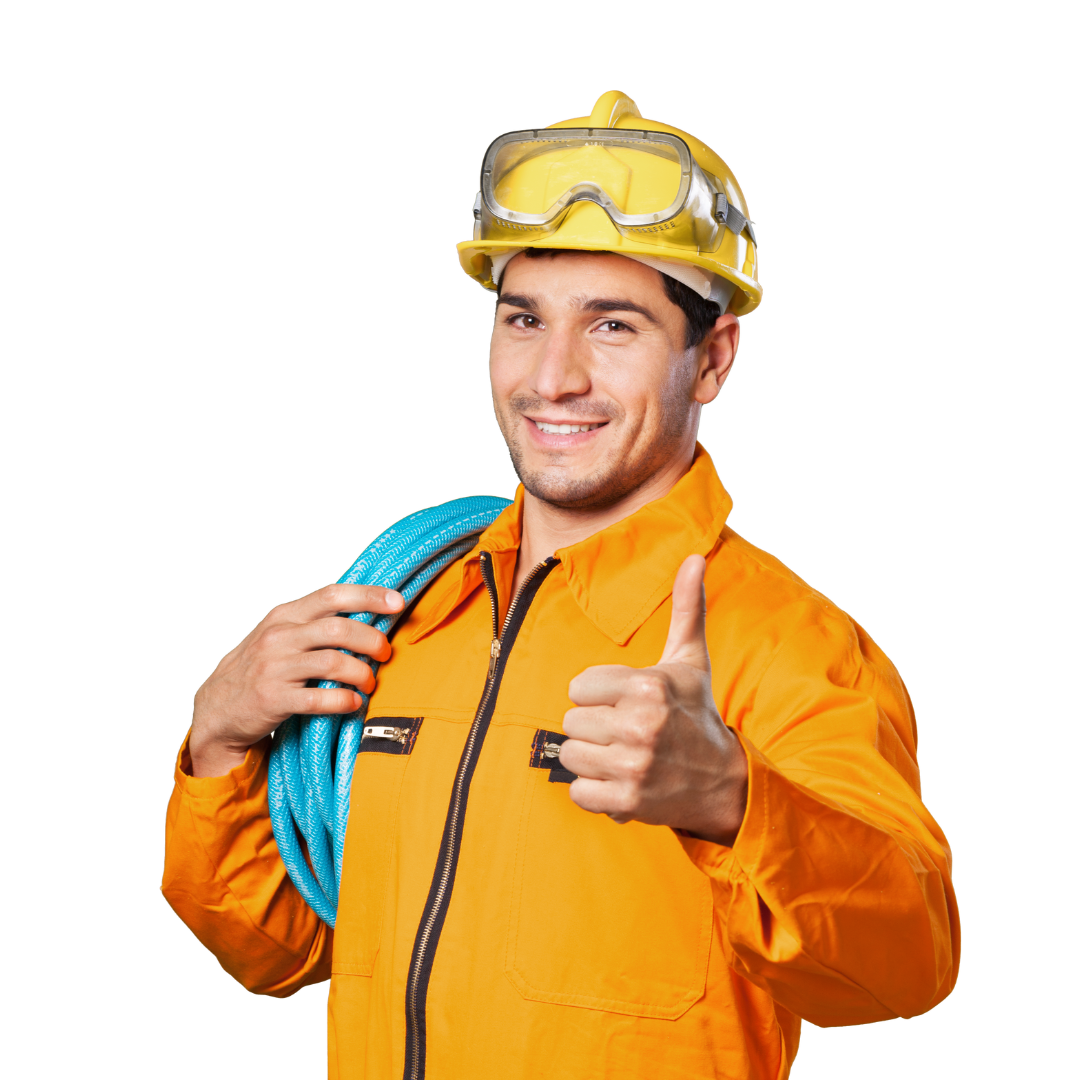A man wearing a hard hat and goggles is giving a thumbs up