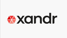 a black and red logo for a company called xandr on a white background .