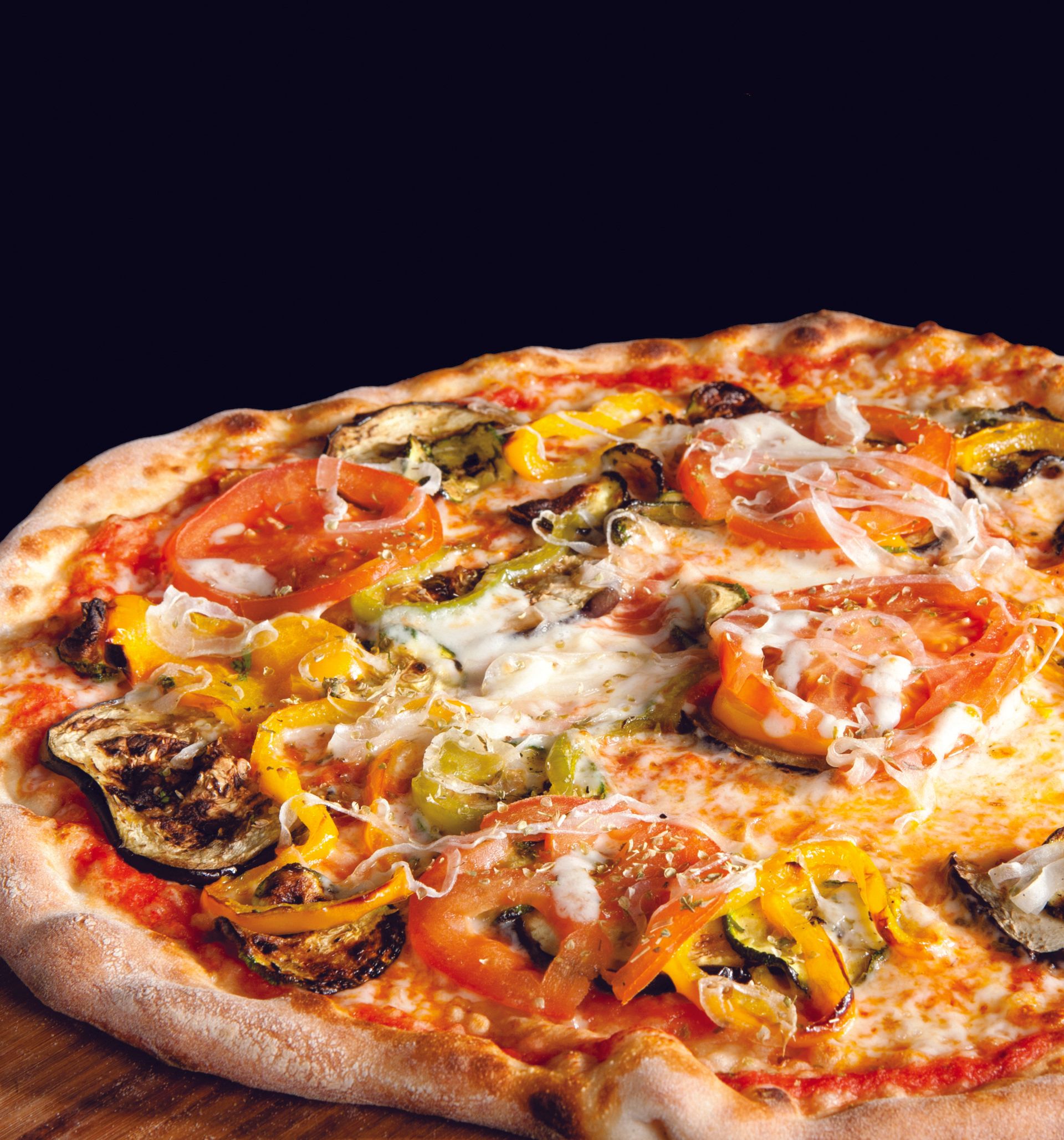 A pizza with a lot of vegetables on it