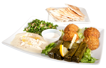 A white plate topped with a variety of food including falafel