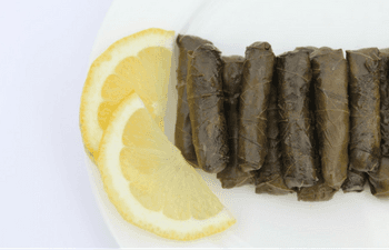 A plate of food with a slice of lemon on it