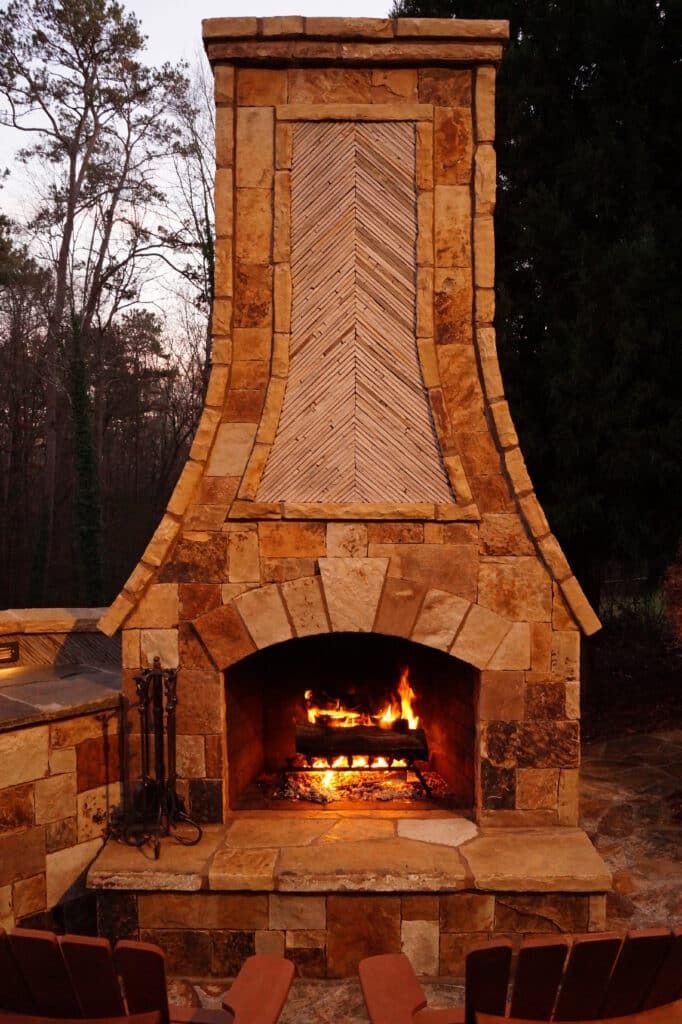 A stone fireplace with a chevron pattern on the chimney