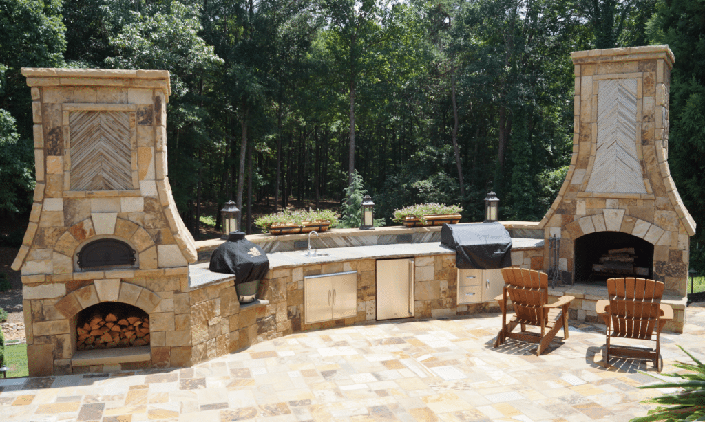 A patio with a fireplace and a pizza oven
