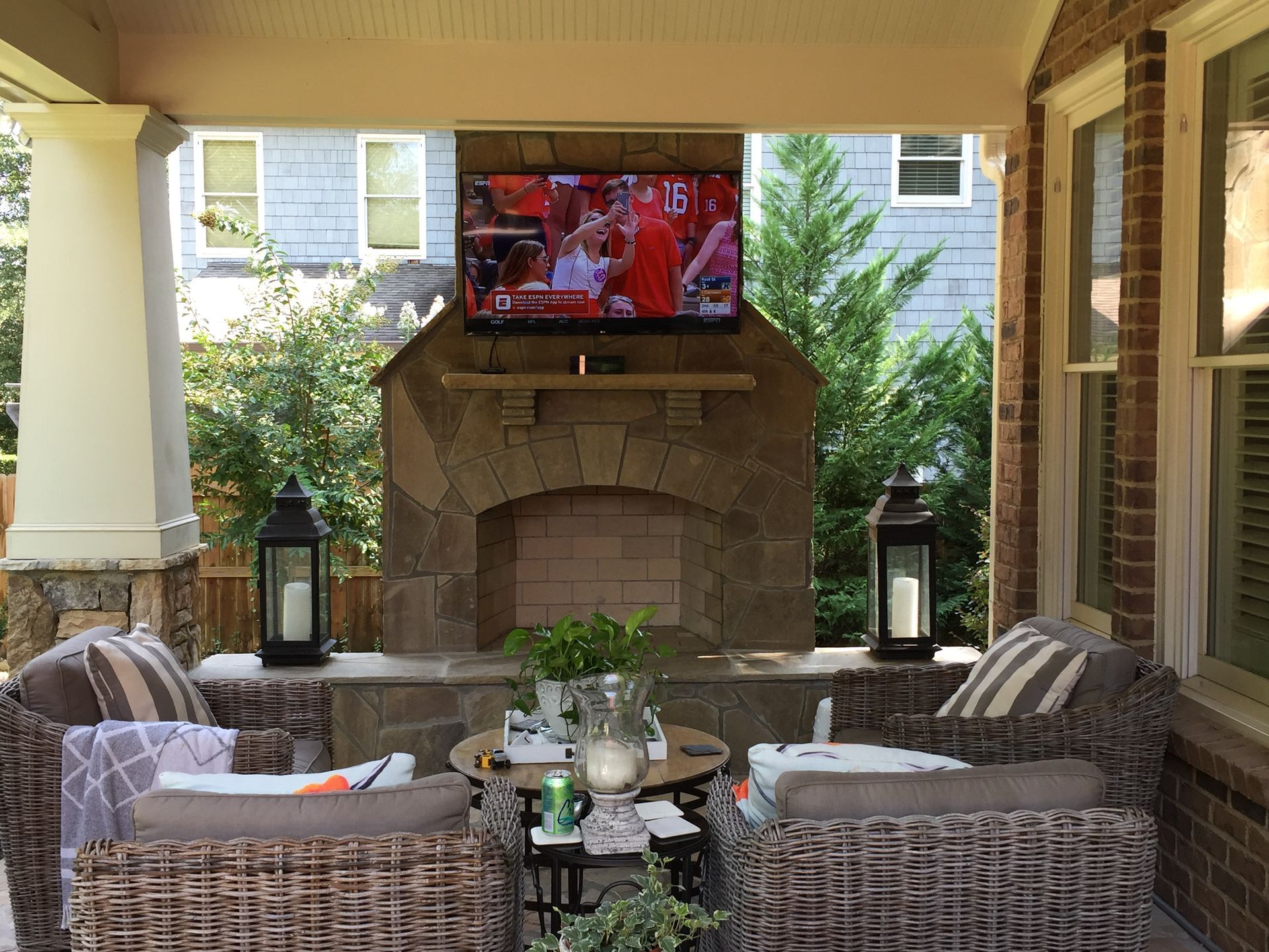A living room with a fireplace and a flat screen tv.