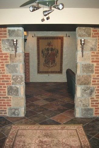 A brick wall with a coat of arms on it