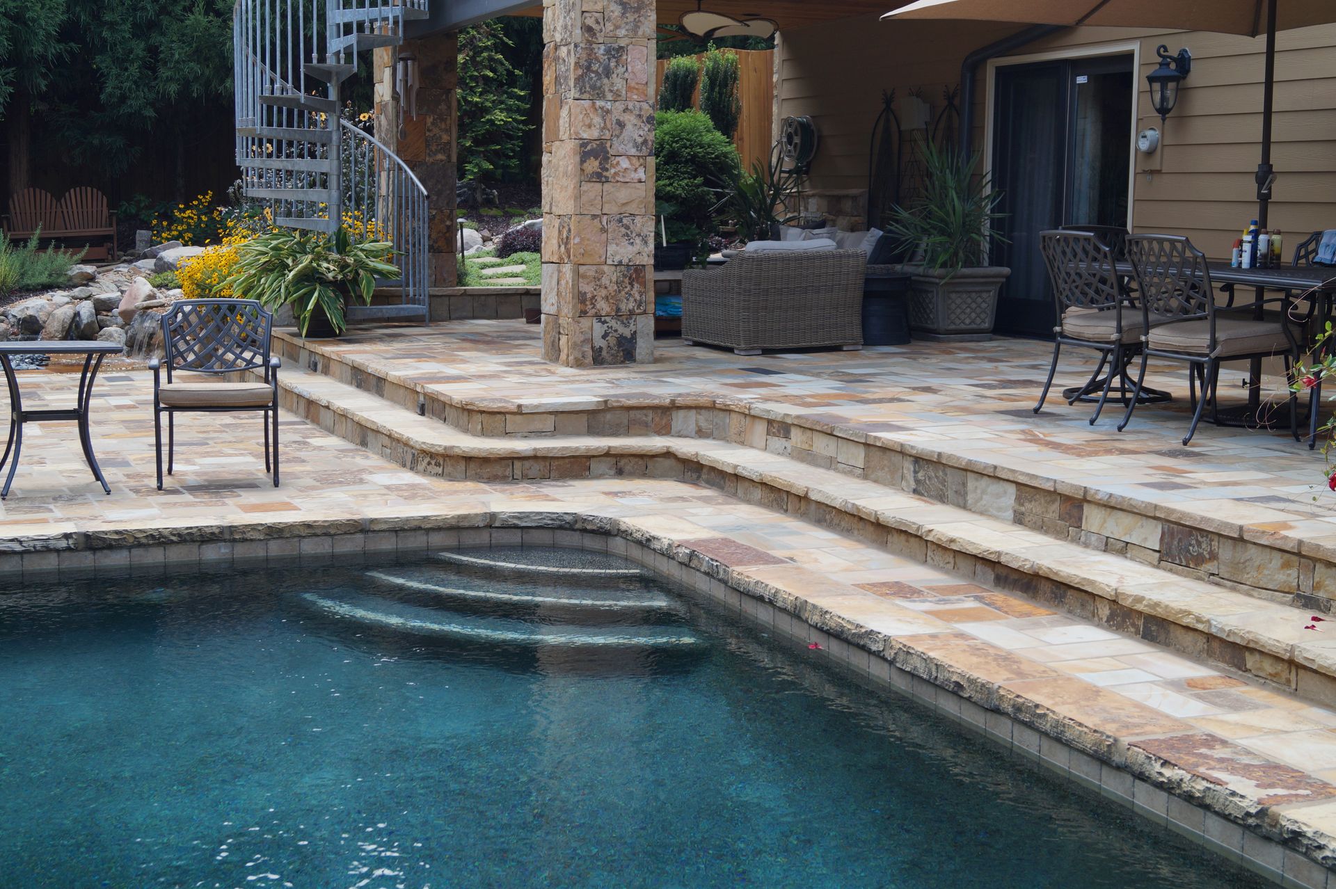 A large swimming pool with stairs leading up to it