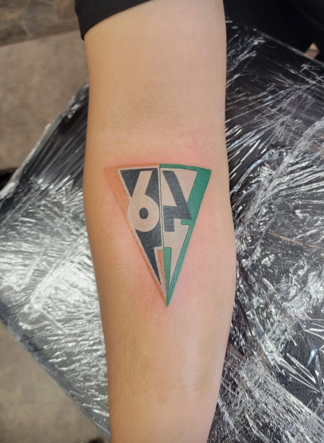 Fine Line Triangle Tattoo