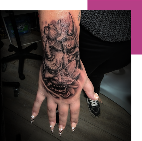 hand tatto with black ink