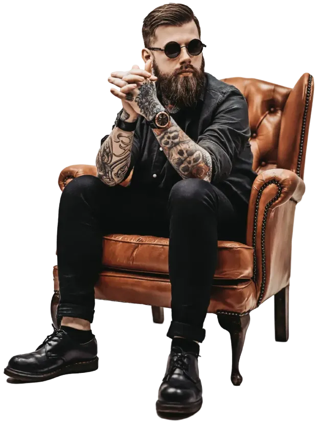 man with tattoo sitting on a chair