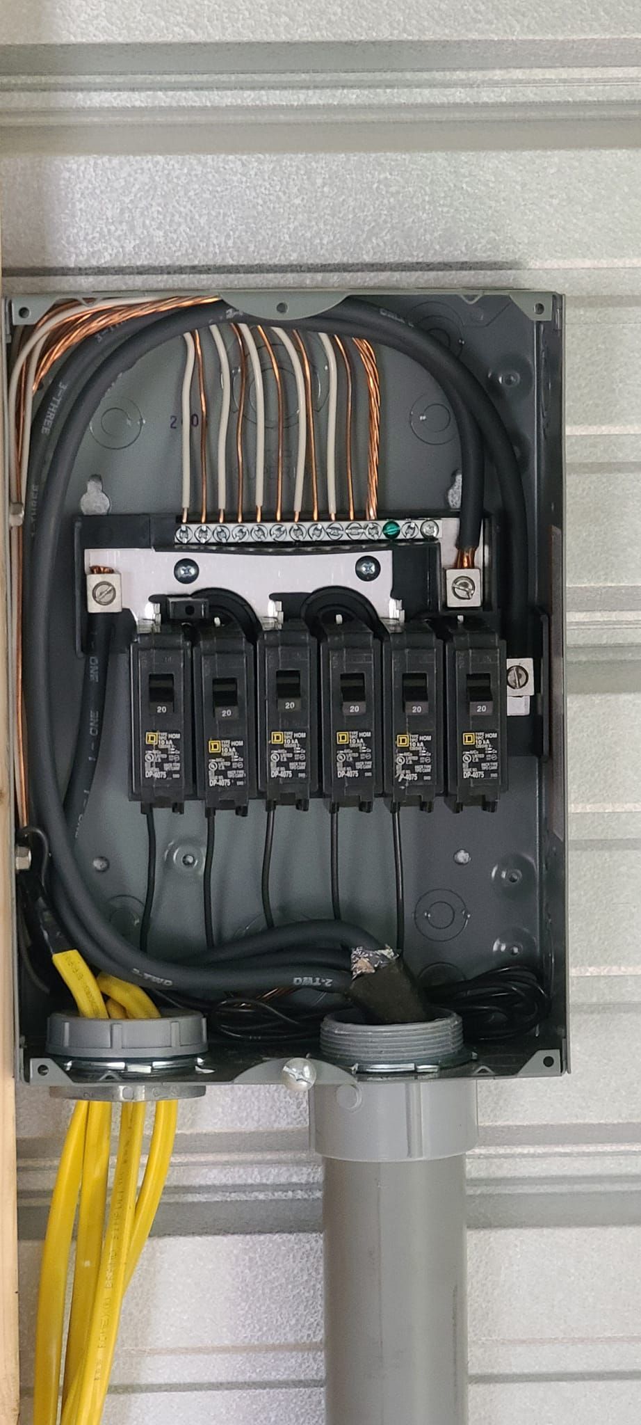 A close up of an electrical box on a wall.