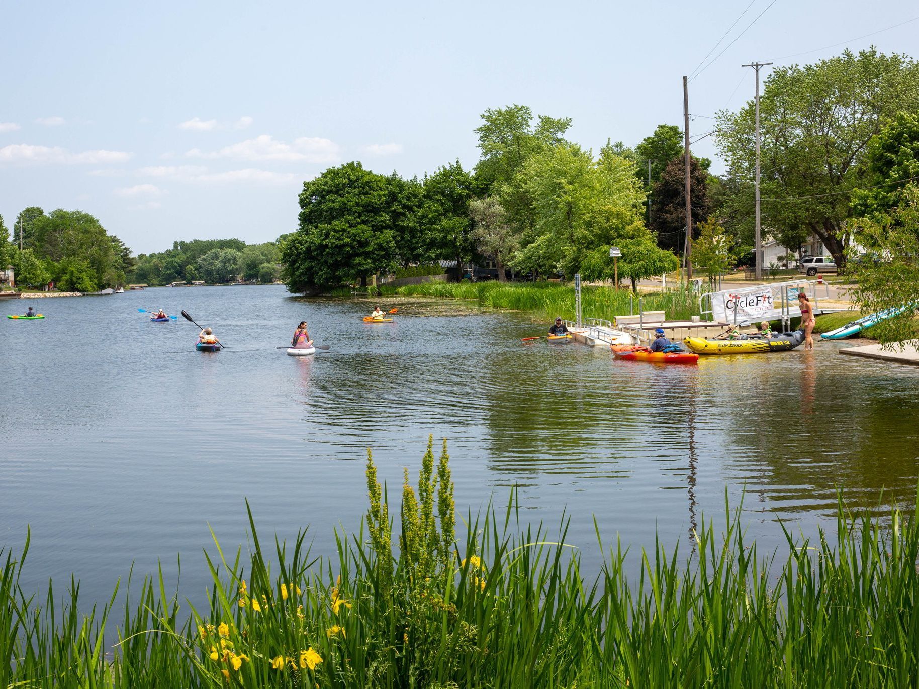 A group of people are kayaking on a lake.