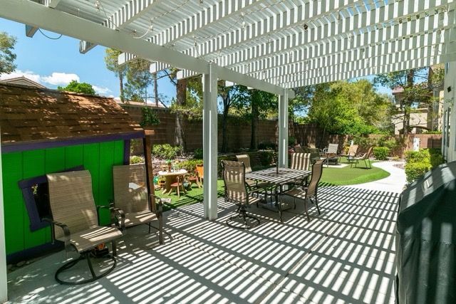 Green Valley backyard with white pergola