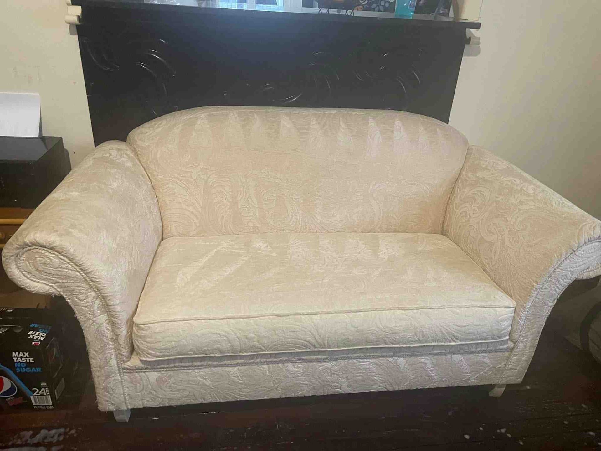 A White Couch is Sitting in a Living Room Next to a Fireplace — Doobies Cleaning Service in Port Macquarie, NSW