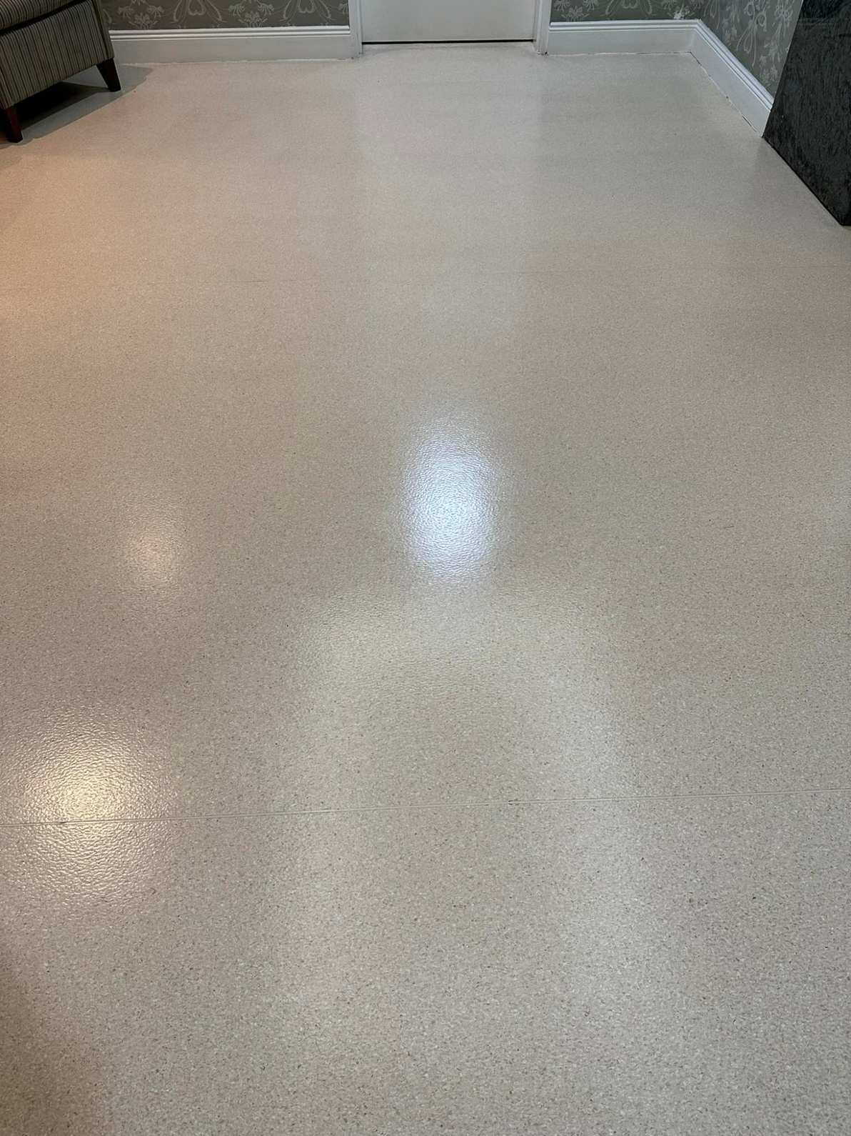 A Living Room With a White Floor and a Chair — Doobies Cleaning Service in South West Rocks, NSW