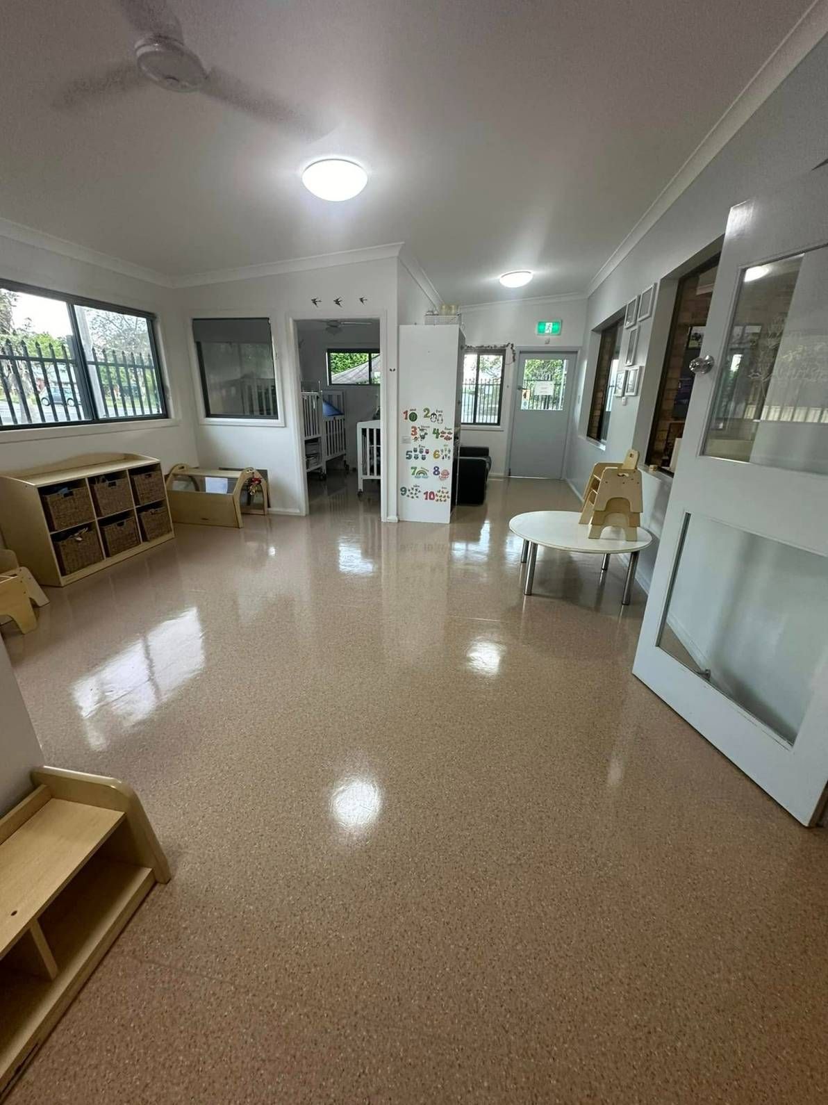 A Large Room With a Carpeted Floor and a Ceiling Fan — Doobies Cleaning Service in Port Macquarie, NSW