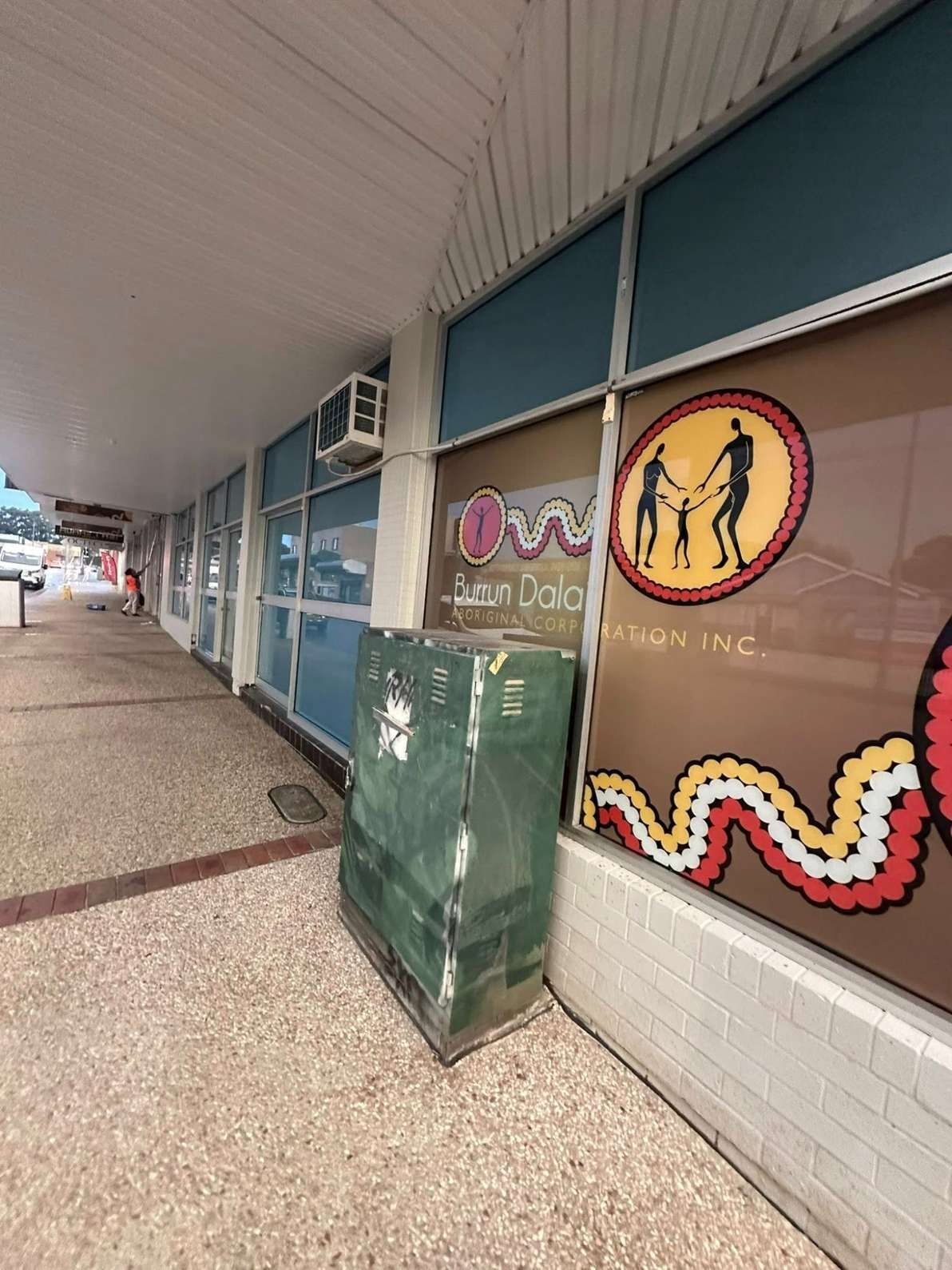 A Building With a Lot of Windows and a Sign on the Side of It — Doobies Cleaning Service in Port Macquarie, NSW