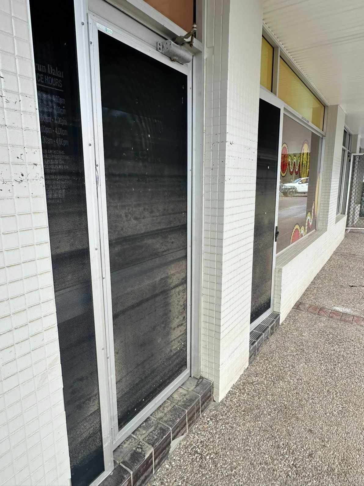 A Building With a Lot of Windows and a Black Door — Doobies Cleaning Service in South West Rocks, NSW