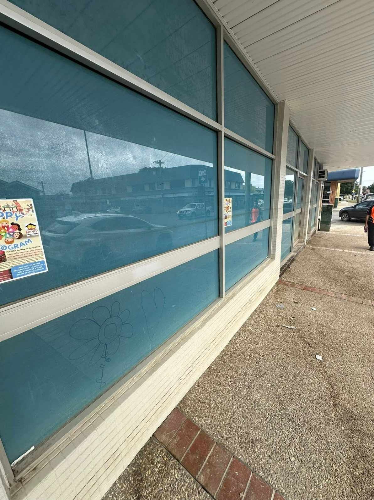 A Building With a Lot of Windows and a Brick Walkway — Doobies Cleaning Service in Port Macquarie, NSW