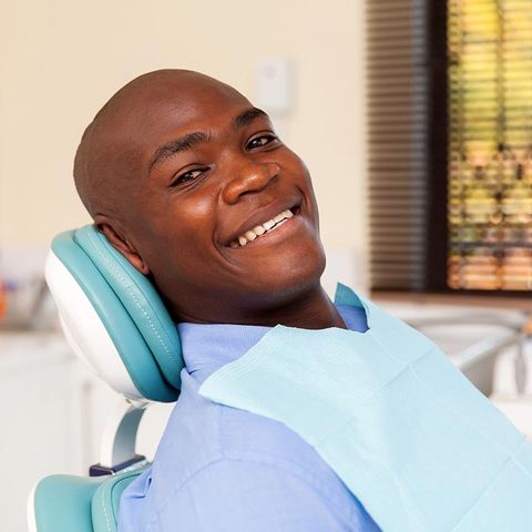 Man Visiting Dentist — Detroit, MI — Paul Dental Group & Ryan Eight Mile Family Dentistry