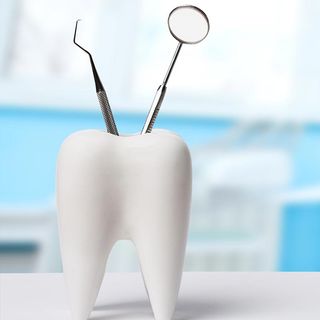 Healthy White Tooth with Dental Equipment — Detroit, MI — Paul Dental Group & Ryan Eight Mile Family Dentistry