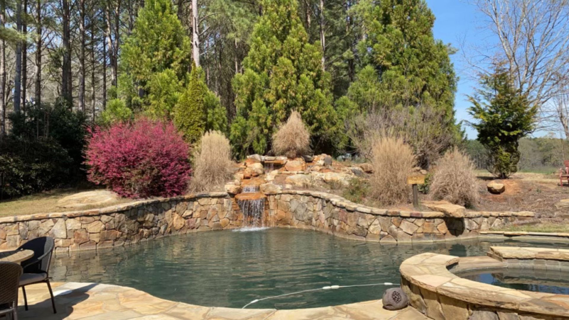 pool with stone retaining wall